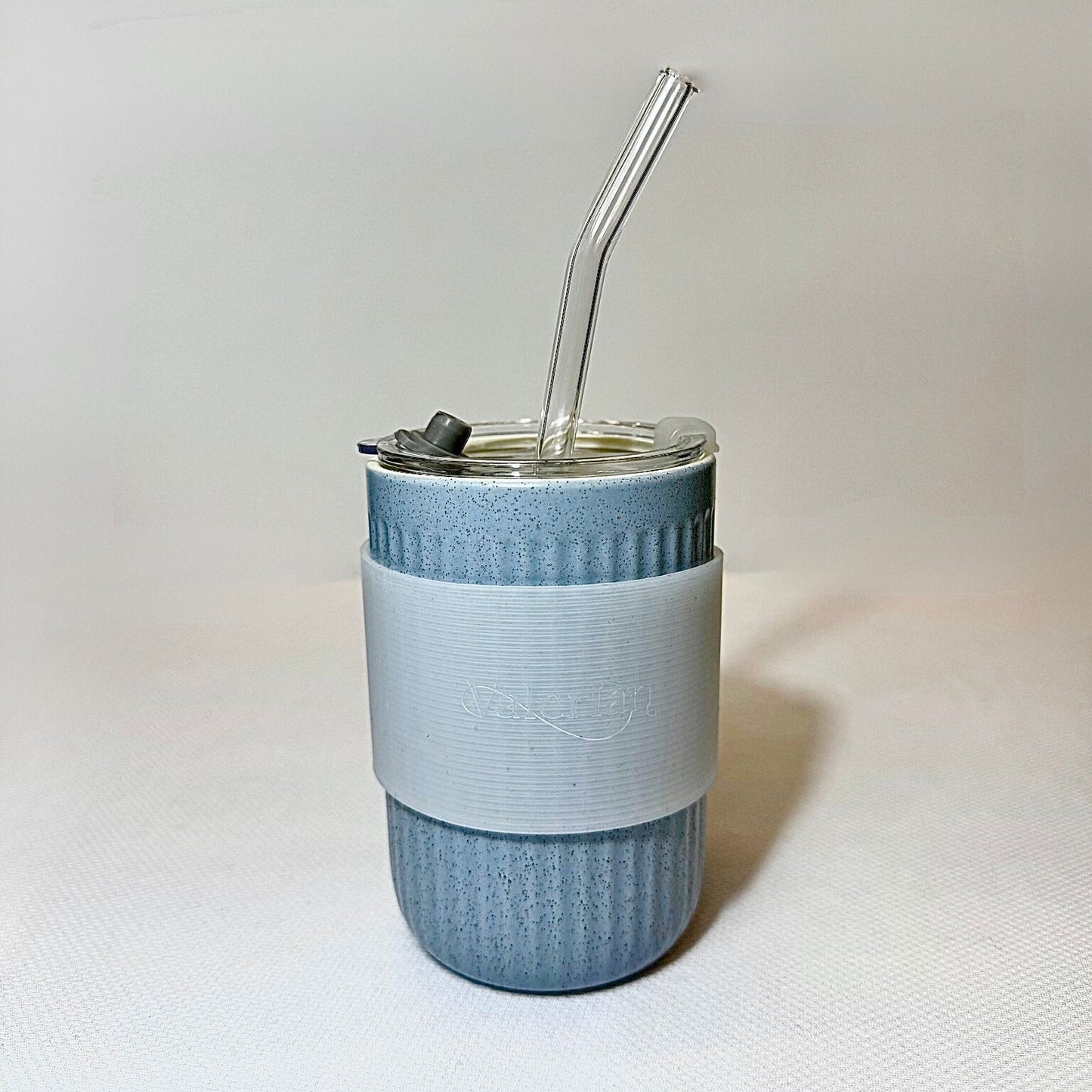 Ceramic cup with straw